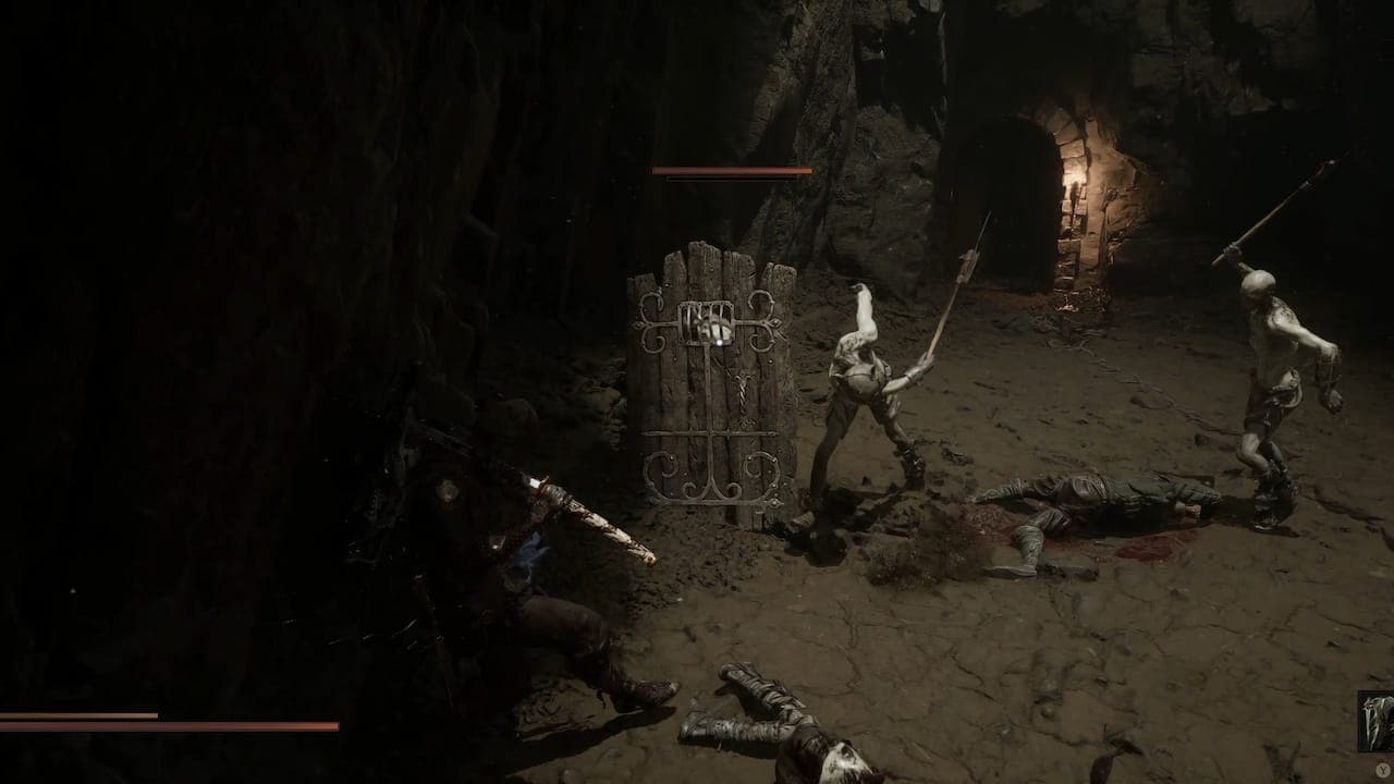 Fighting enemies in Mortal Shell 2.