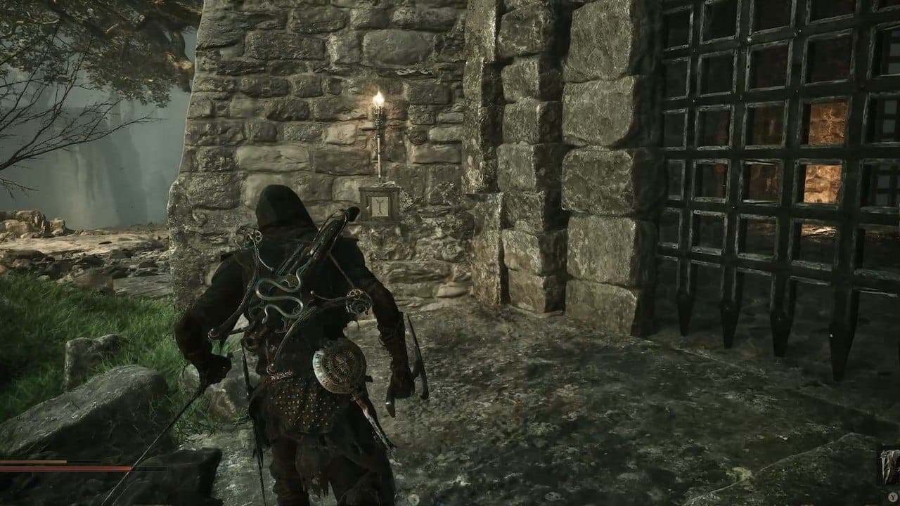 Button on wall in Mortal Shell 2.