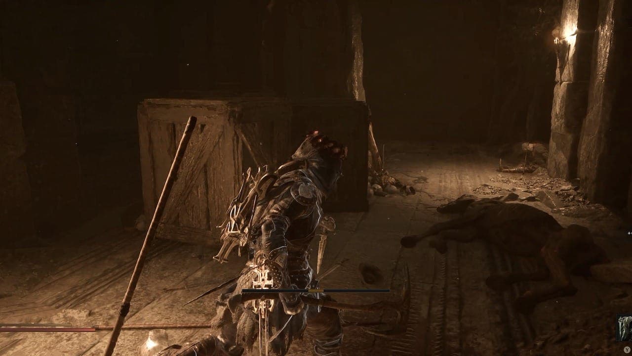 Gate with boxes in Mortal Shell 2.